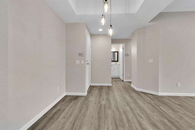 spare room featuring light hardwood / wood-style floors