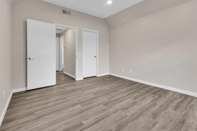 unfurnished bedroom featuring light wood-type flooring