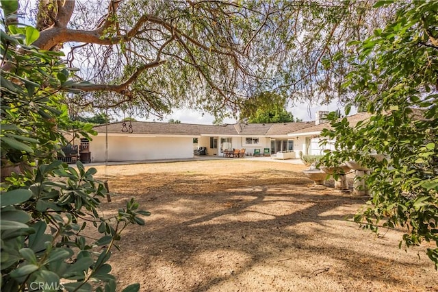 ranch-style home featuring a patio