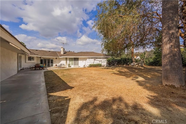 view of yard with a patio area