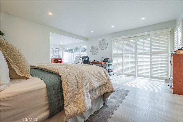 bedroom with light hardwood / wood-style floors