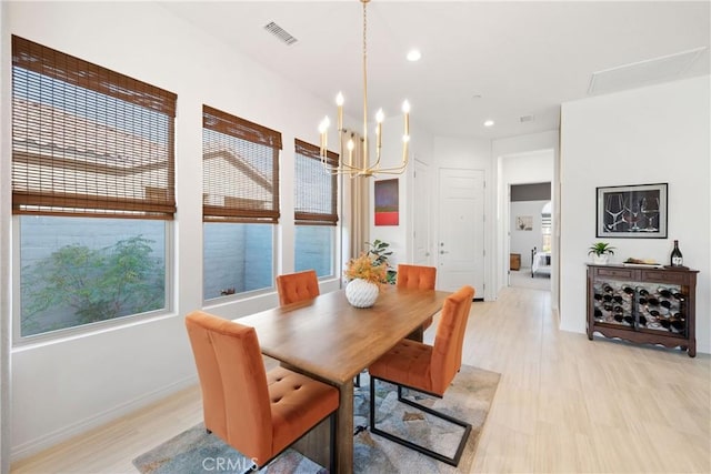 48 Vintage, Rancho Mirage, CA 92270 - dining area with a chandelier, light wood-type flooring, recessed lighting, and baseboards