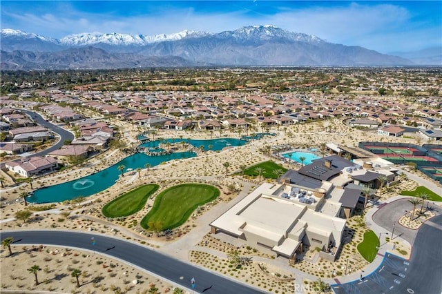 birds eye view of property featuring a mountain view