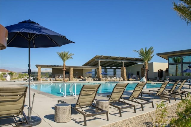 view of pool with a pergola and a patio area