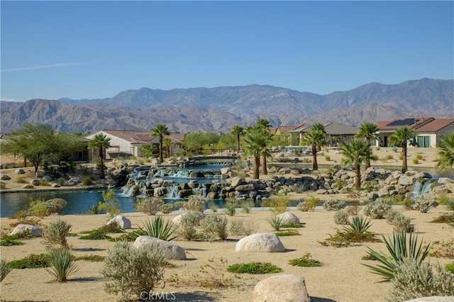 view of property's community with a water and mountain view