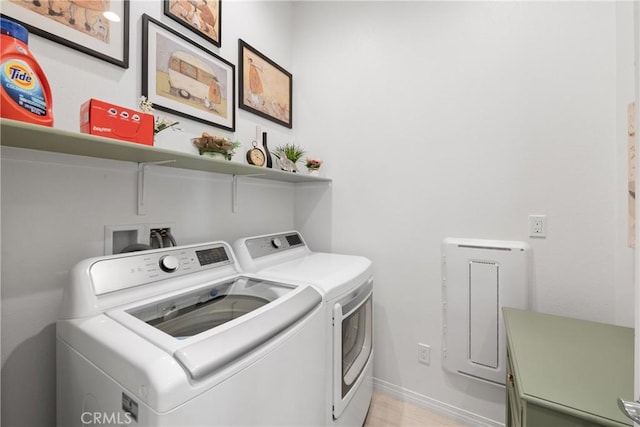 washroom with washing machine and dryer