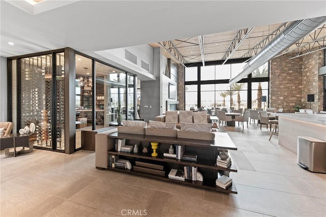 48 Vintage, Rancho Mirage, CA 92270 - building lobby with expansive windows and a towering ceiling