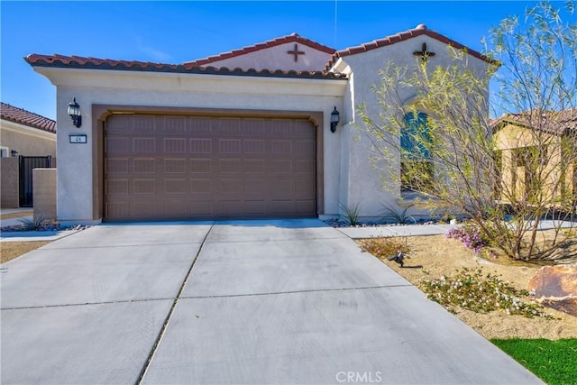 48 Vintage, Rancho Mirage, CA 92270 - mediterranean / spanish house featuring stucco siding, concrete driveway, a garage, and a tile roof