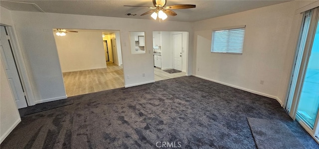 unfurnished room with light carpet and ceiling fan