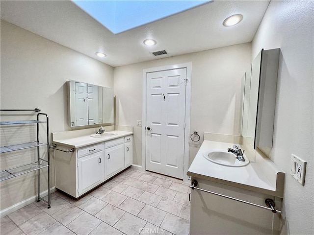 bathroom with vanity and tile patterned flooring