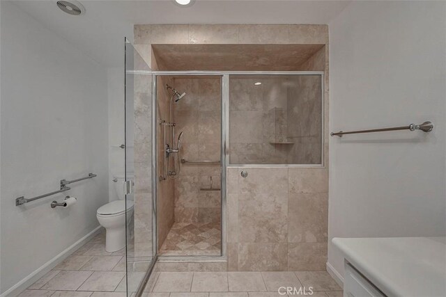 241 Calle Aragon Unit B, Laguna Woods, CA 92637 - full bath featuring a shower stall, toilet, and tile patterned floors
