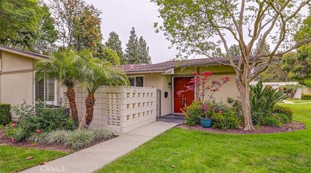 241 Calle Aragon Unit B, Laguna Woods, CA 92637 - view of front of home with stucco siding