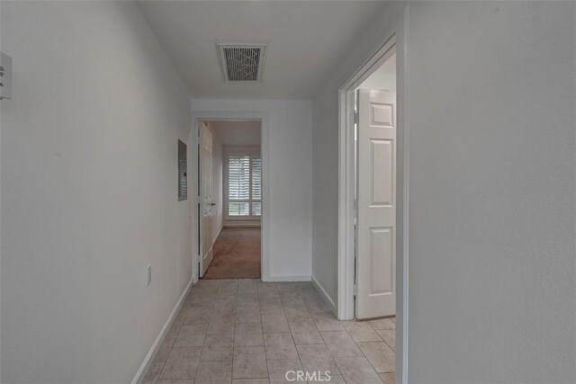 241 Calle Aragon Unit B, Laguna Woods, CA 92637 - hallway featuring baseboards and light tile patterned floors