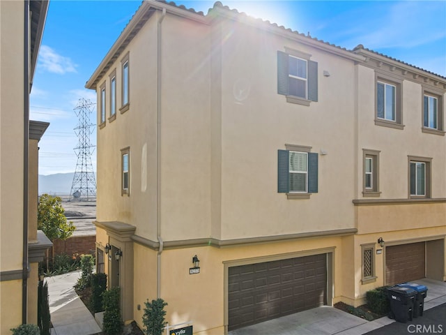 view of side of property featuring a garage