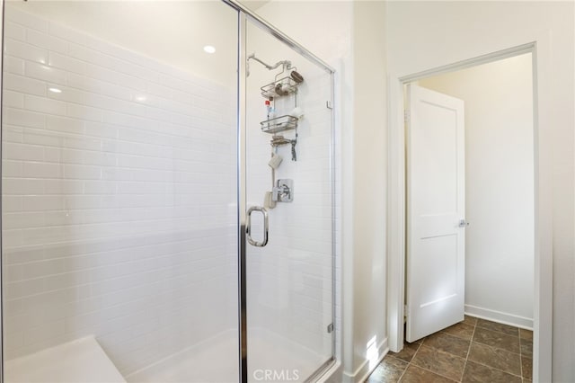 bathroom with a shower with shower door