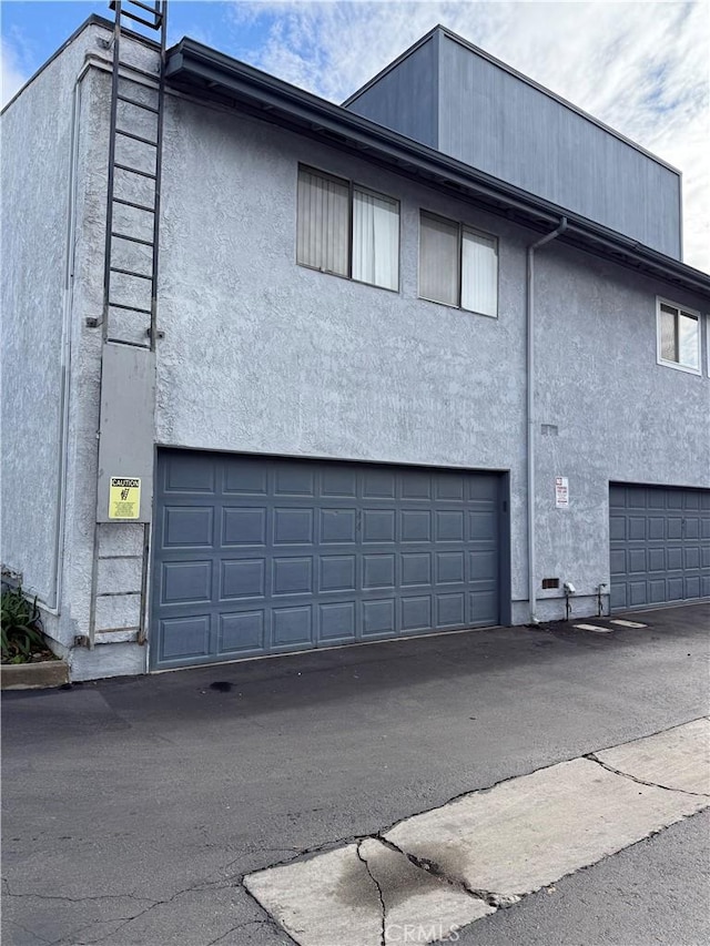 view of side of home with a garage