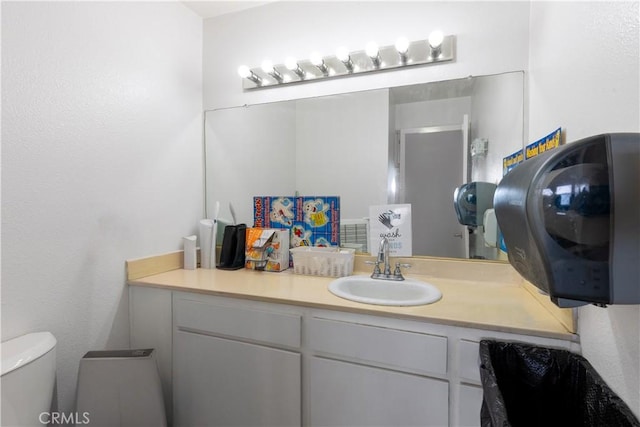 bathroom with vanity and toilet