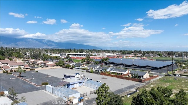 birds eye view of property featuring a mountain view