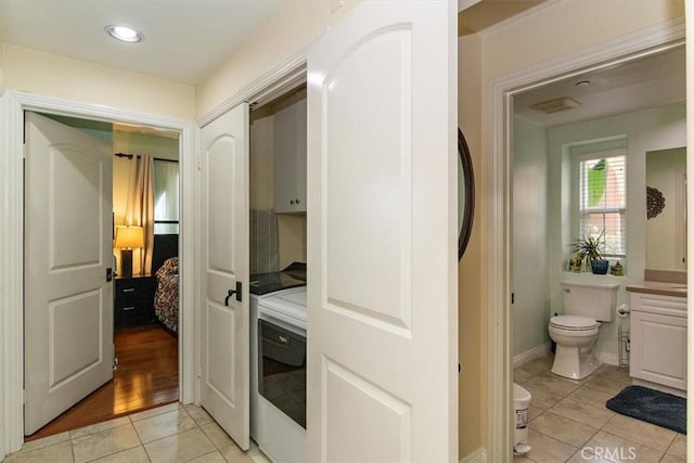 bathroom with tile patterned floors, toilet, and vanity