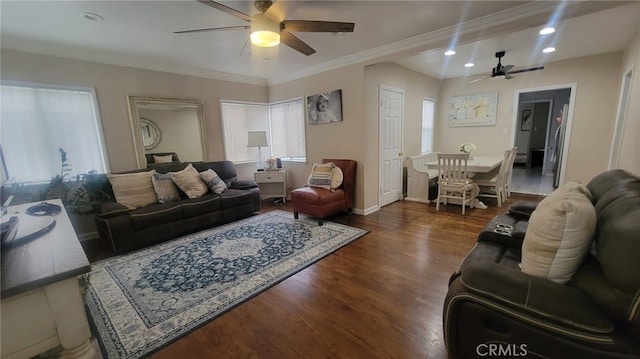 living room with crown molding, dark hardwood / wood-style floors, and ceiling fan