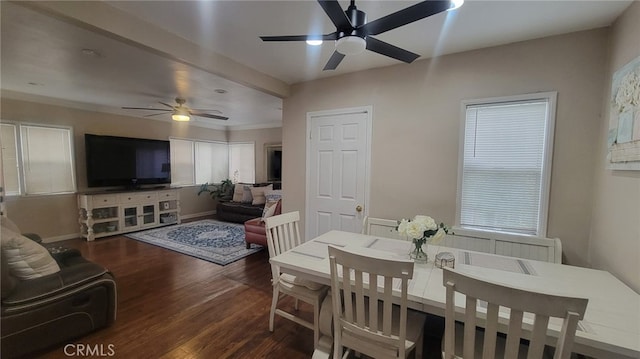 dining space featuring dark wood-type flooring and ceiling fan