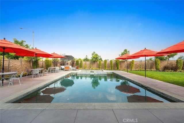 view of pool featuring a yard and a patio area