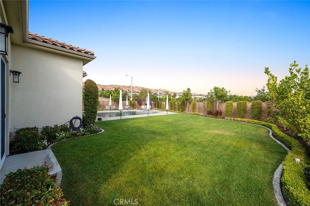 view of yard featuring a fenced in pool