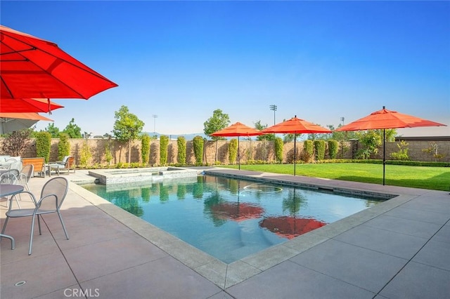 view of swimming pool featuring an in ground hot tub, a patio, and a lawn