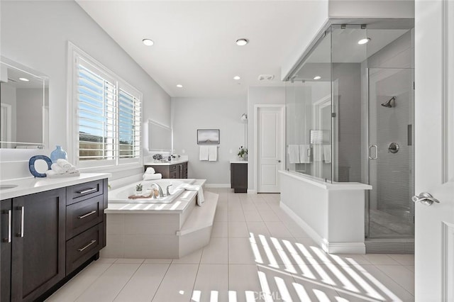 bathroom with vanity, tile patterned floors, and separate shower and tub