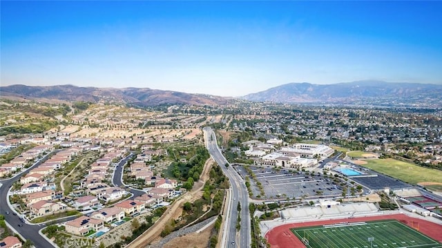 birds eye view of property with a mountain view