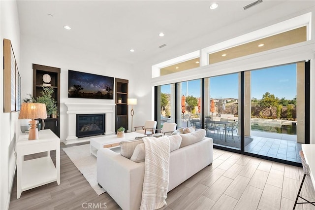 living room with light hardwood / wood-style flooring