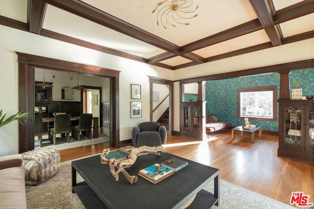 living room with beam ceiling, hardwood / wood-style flooring, and coffered ceiling