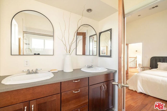 bathroom featuring vanity and hardwood / wood-style flooring