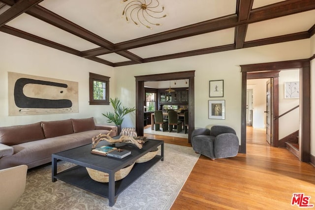 living room with hardwood / wood-style flooring, coffered ceiling, and beamed ceiling