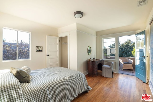 bedroom featuring wood-type flooring