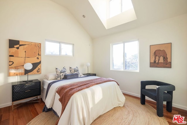 bedroom featuring vaulted ceiling and wood-type flooring