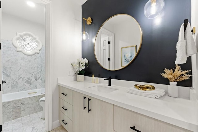 full bathroom with vanity, toilet, and tiled shower / bath