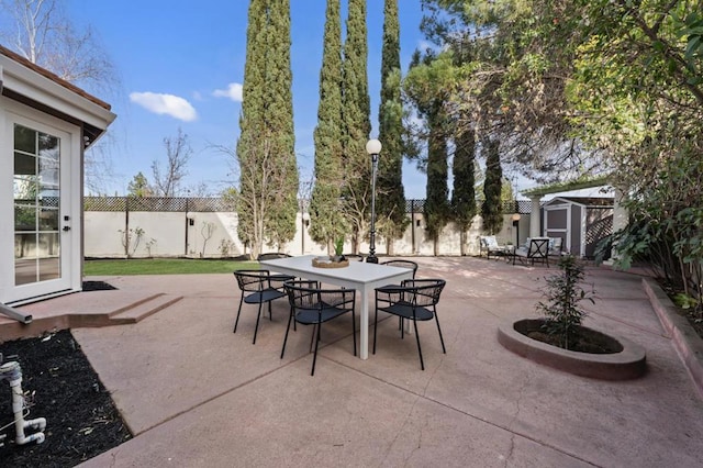 view of patio featuring a shed