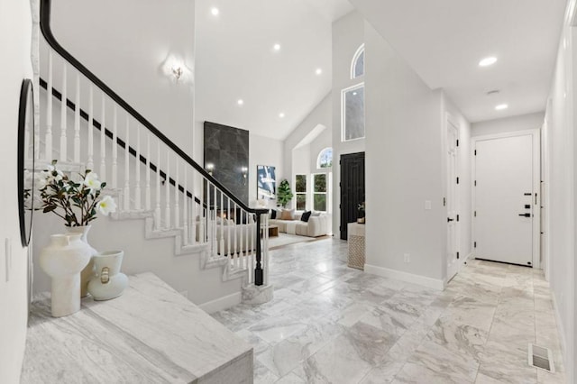 entryway with high vaulted ceiling