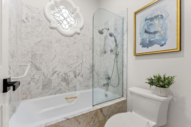 bathroom with toilet and tiled shower / bath combo