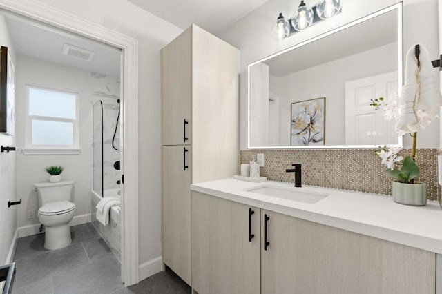 full bathroom featuring vanity, toilet, bathing tub / shower combination, and decorative backsplash