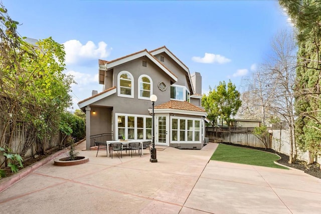 rear view of property with a patio area