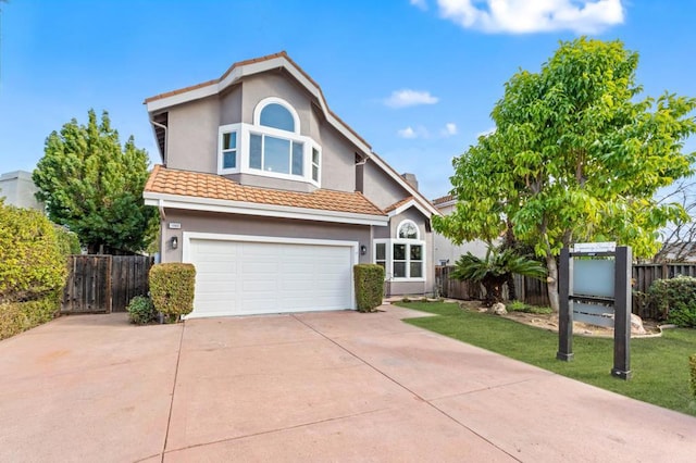 front of property featuring a garage and a front yard