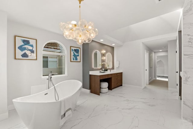 bathroom featuring vanity and a tub