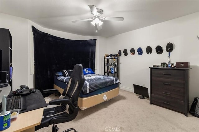 bedroom featuring carpet floors, baseboards, and a ceiling fan