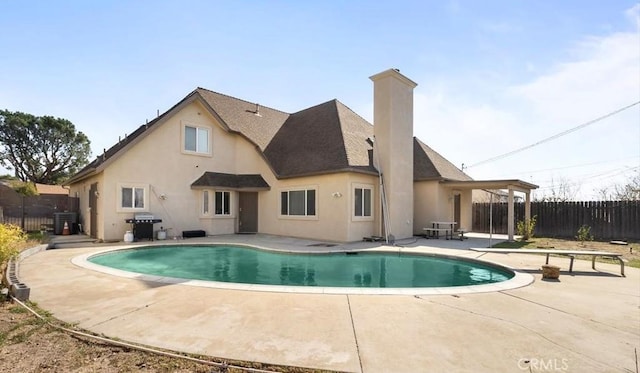 view of swimming pool featuring a fenced backyard, grilling area, a fenced in pool, and a patio