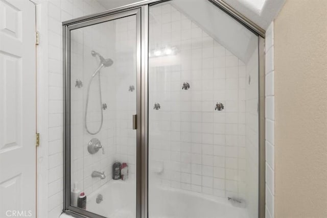 full bath featuring combined bath / shower with glass door