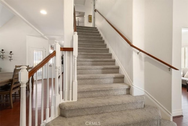 stairs featuring baseboards