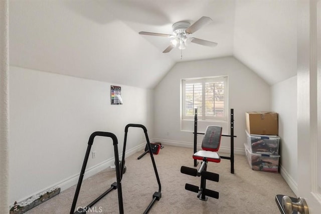 workout room featuring lofted ceiling, carpet, and baseboards