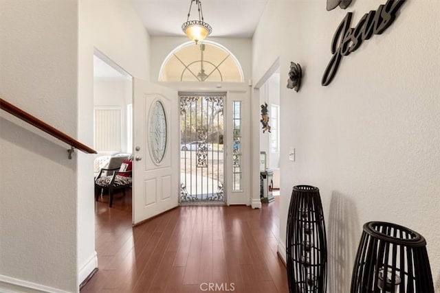 entryway with wood finished floors